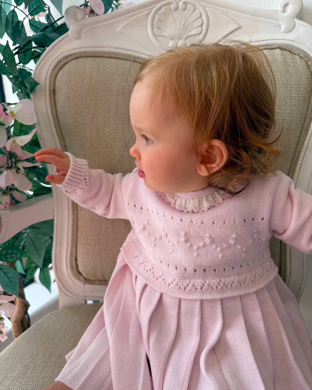 Sarah Louise Adeline pink knitted girls dress with ivory frill collar, hand embroidered roses and pleated skirt.