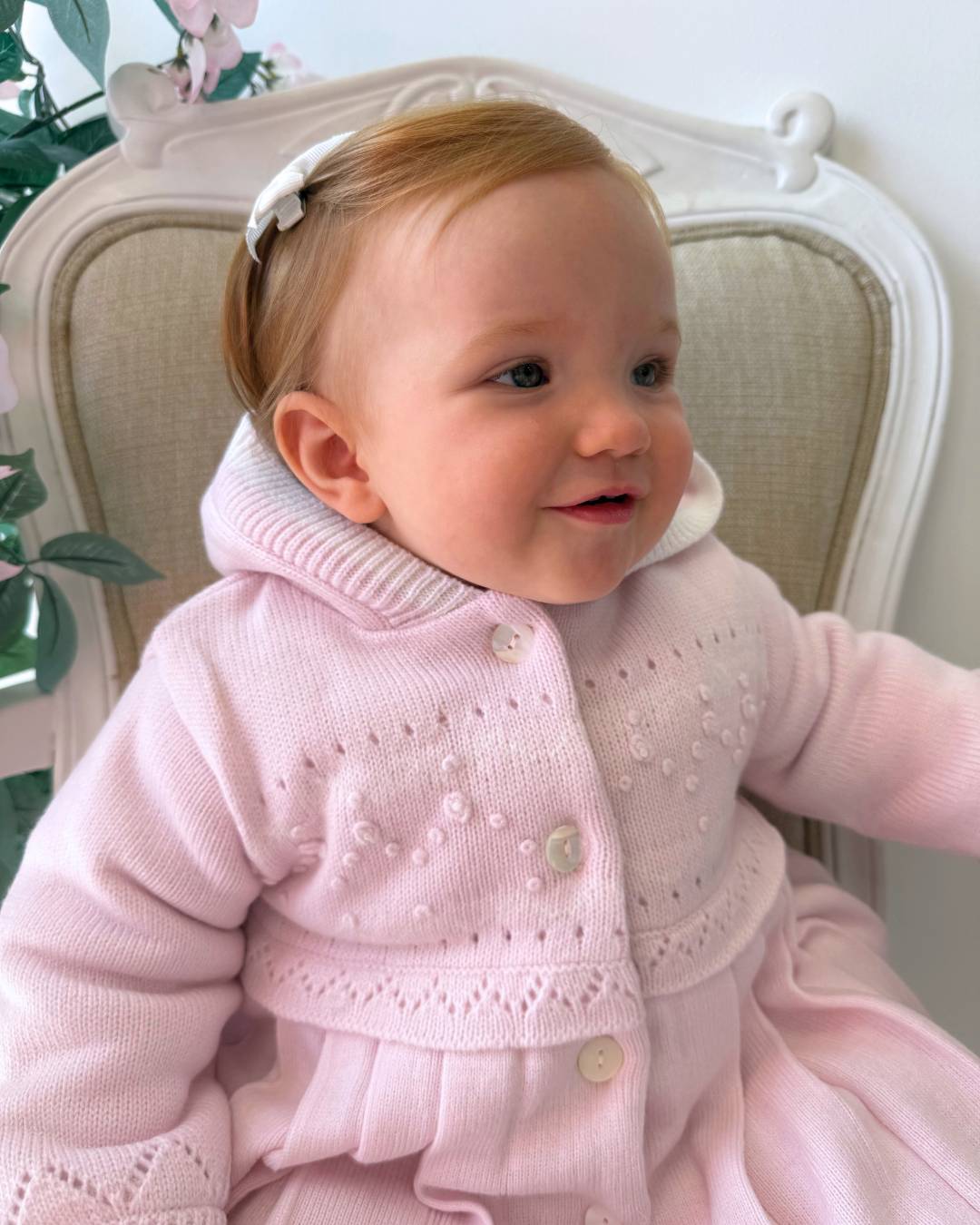 Sarah Louise Adeline pink double knit girls coat with hood, embroidered detailing, button fastening and pleated skirt.