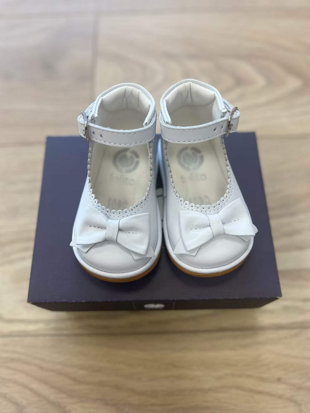 Fofito Ruby Bow Shoes featuring a classic bar shoe design, decorative bow detail, padded collar, cushioned insole and breathable lining.