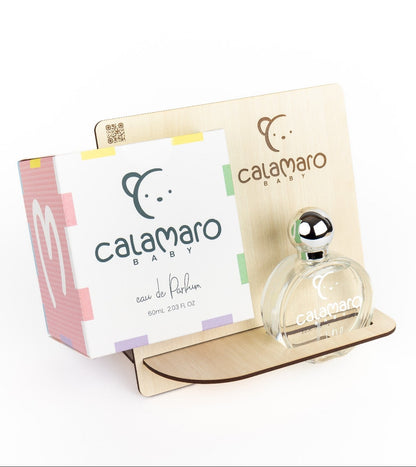 Calamaro Baby Eau de Parfum 60ml in a clear glass perfume bottle with silver lid, presented alongside colourful Calamaro gift packaging.