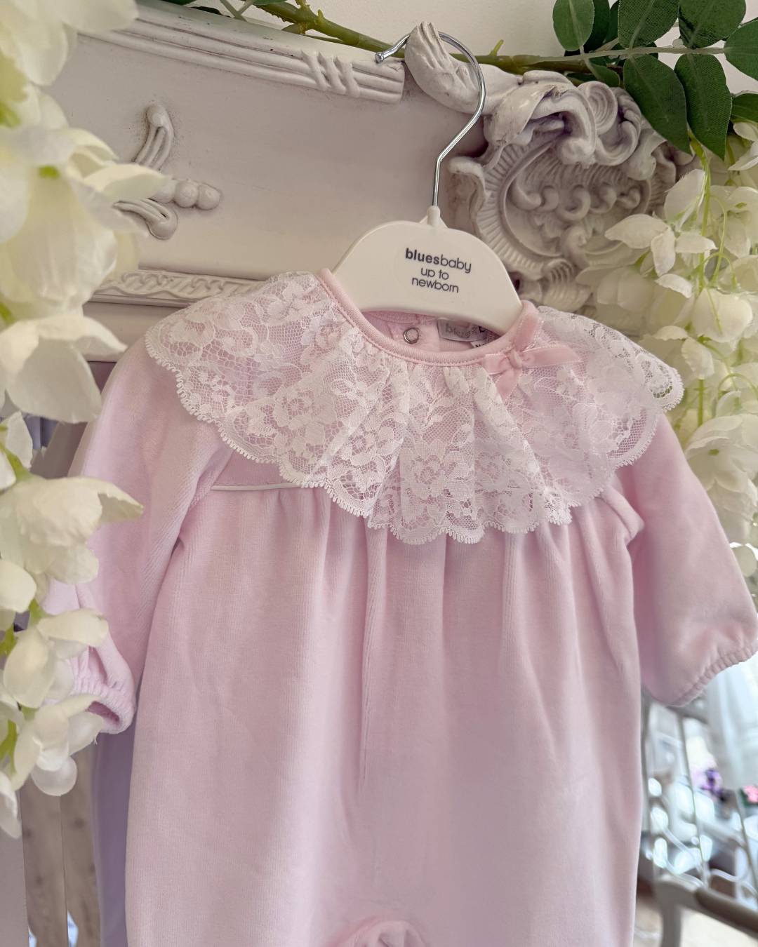 Bluesbaby Elodie Lace Velour Babygrow in baby pink with white lace frill collar, velvet bow and matching pink baby hat.