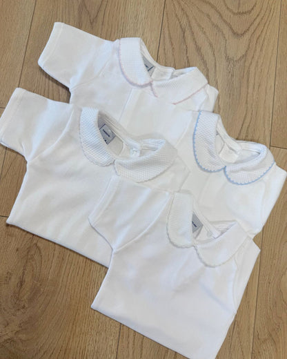 Babidu white unisex baby bodysuit with Peter Pan collar and coloured stitch trim.