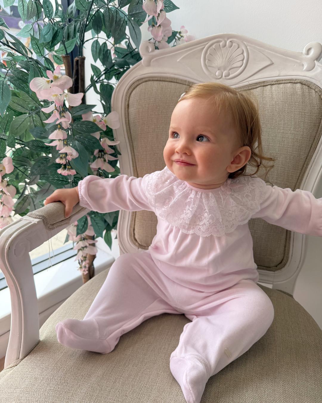 Bluesbaby Elodie Lace Velour Babygrow in baby pink with white lace frill collar, velvet bow and matching pink baby hat.