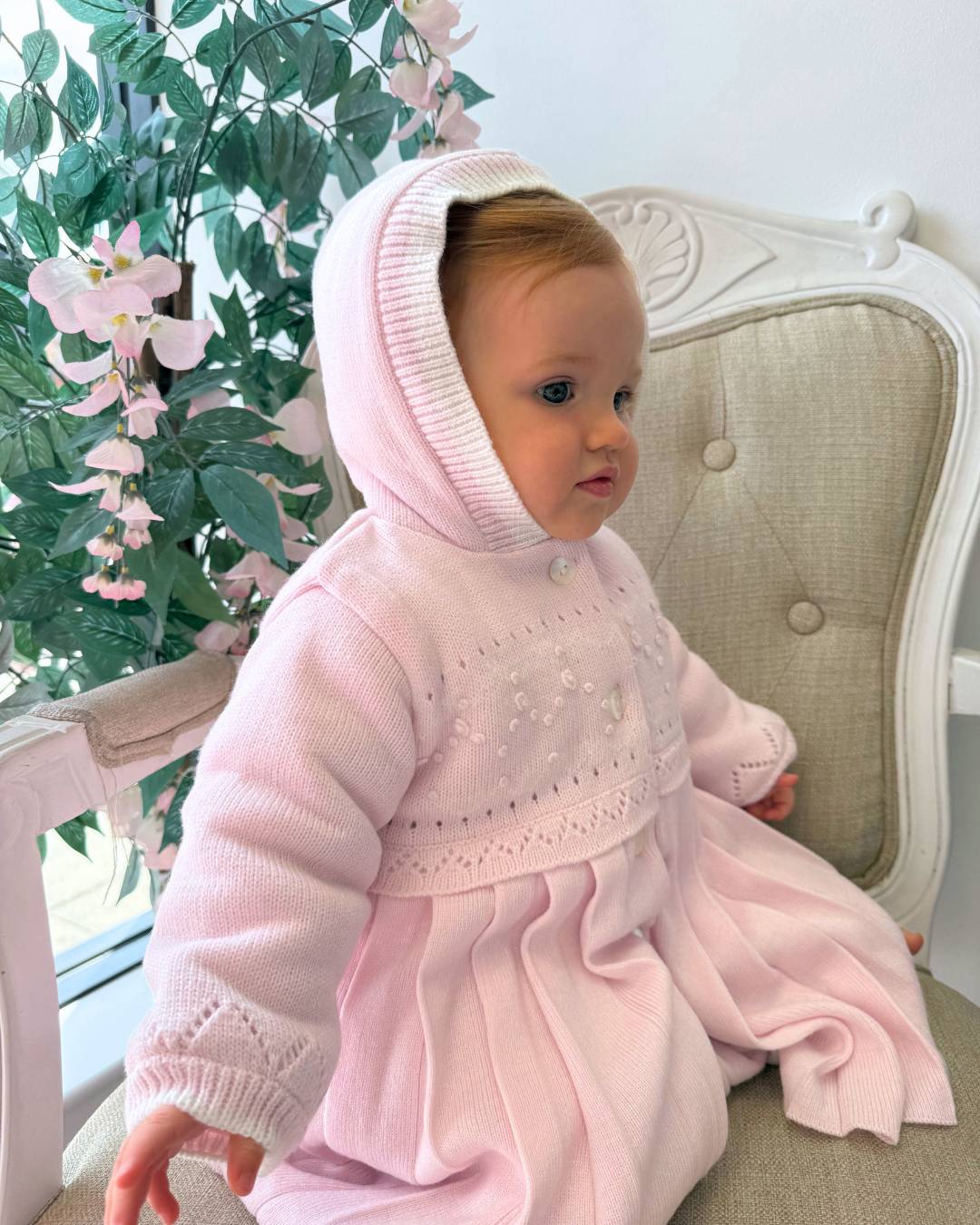Sarah Louise Adeline pink double knit girls coat with hood, embroidered detailing, button fastening and pleated skirt.