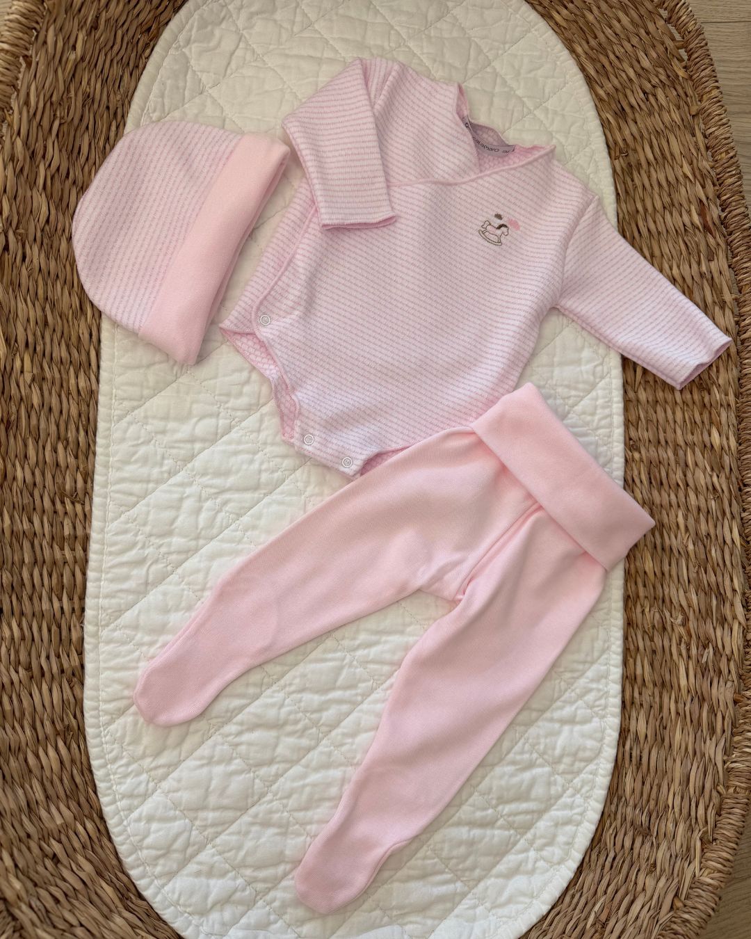 Calamaro Rocking Horse newborn baby gift set in pink and blue, featuring a striped wrap bodysuit with embroidered rocking horse, matching footed trousers and coordinating hat.