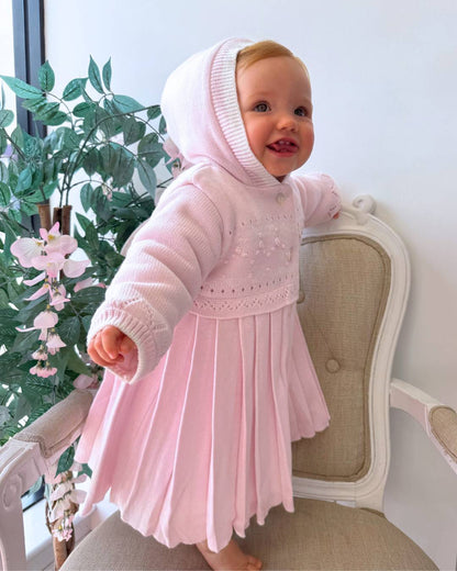 Sarah Louise Adeline pink double knit girls coat with hood, embroidered detailing, button fastening and pleated skirt.