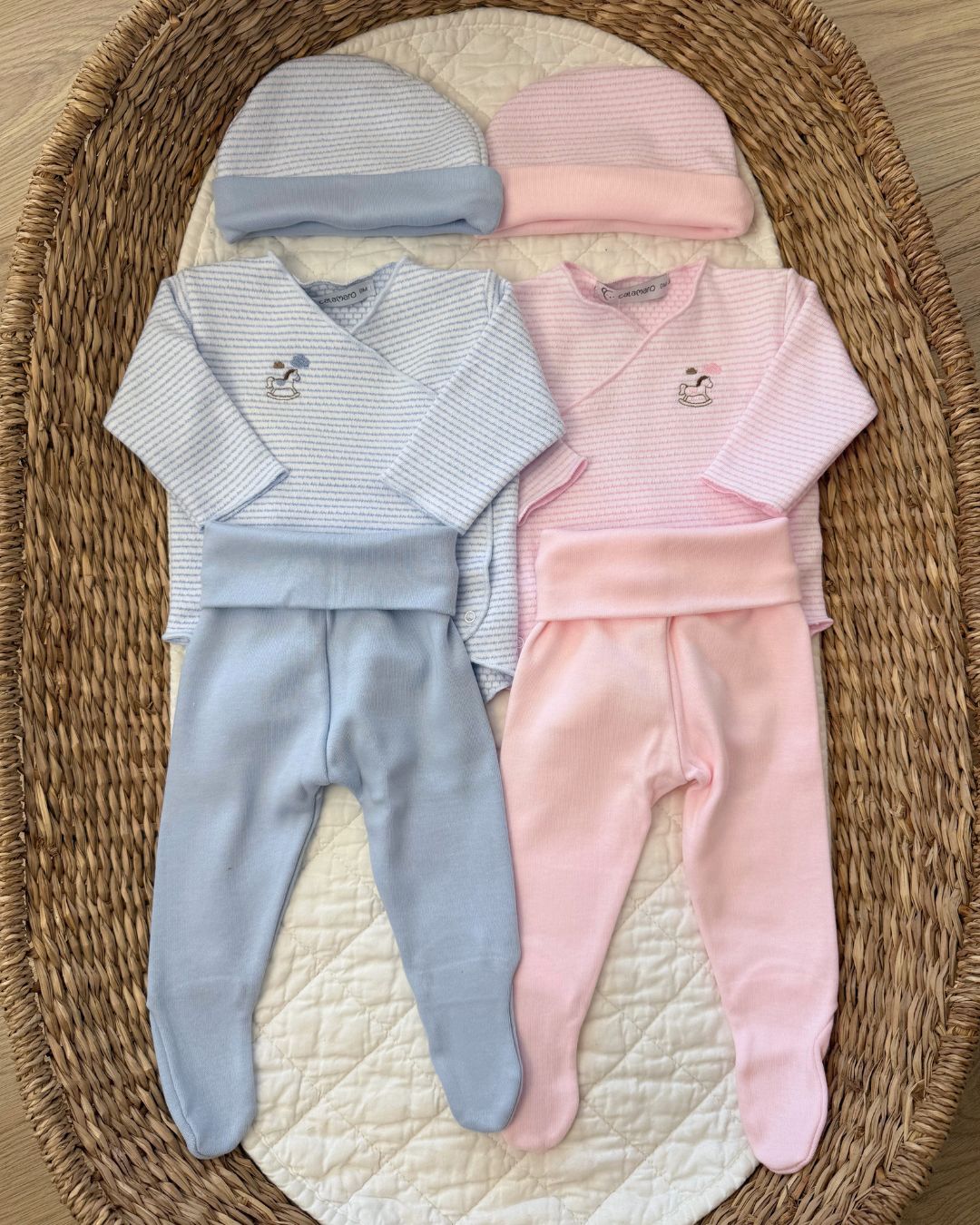 Calamaro Rocking Horse newborn baby gift set in pink and blue, featuring a striped wrap bodysuit with embroidered rocking horse, matching footed trousers and coordinating hat.