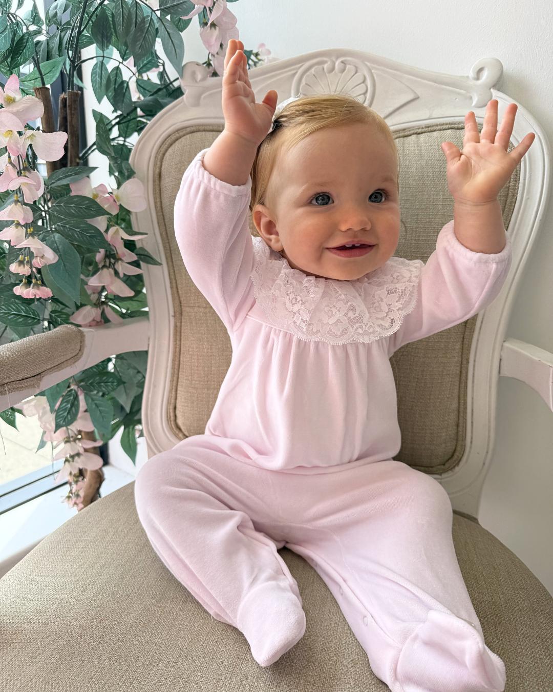 Bluesbaby Elodie Lace Velour Babygrow in baby pink with white lace frill collar, velvet bow and matching pink baby hat.