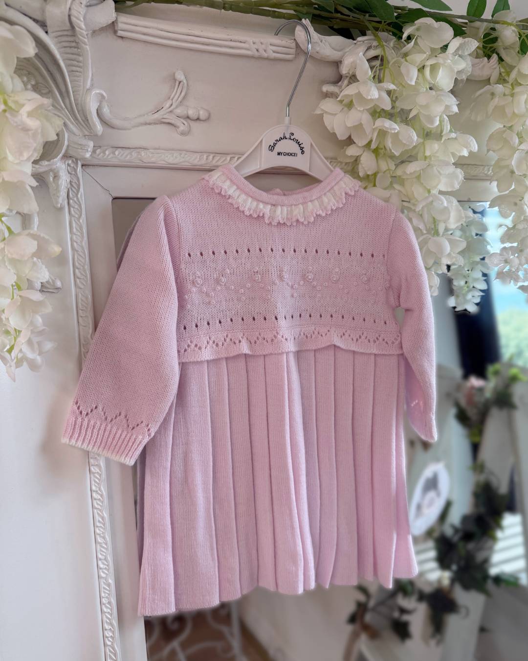 Sarah Louise Adeline pink knitted girls dress with ivory frill collar, hand embroidered roses and pleated skirt.