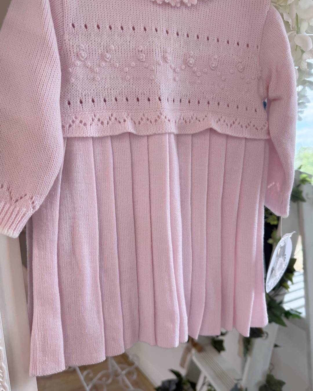 Sarah Louise Adeline pink knitted girls dress with ivory frill collar, hand embroidered roses and pleated skirt.