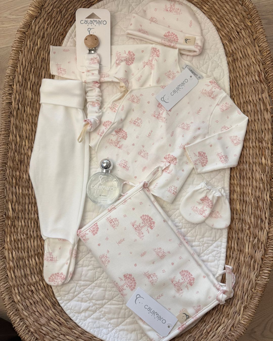 Calamaro Mon Cheri newborn baby gift set in ivory with pink or blue woodland print, matching accessories, nappy bag organiser and baby perfume.