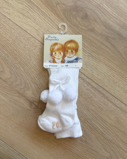 Pretty Originals unisex baby tights in white and ivory with soft pom pom detailing at the outer sides.