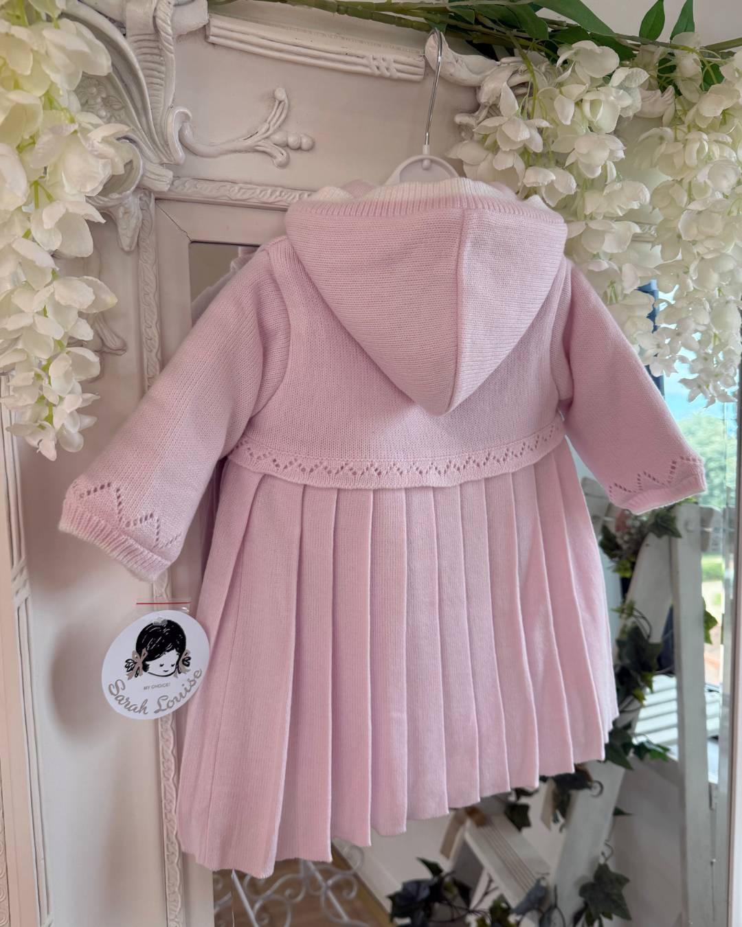 Sarah Louise Adeline pink double knit girls coat with hood, embroidered detailing, button fastening and pleated skirt.