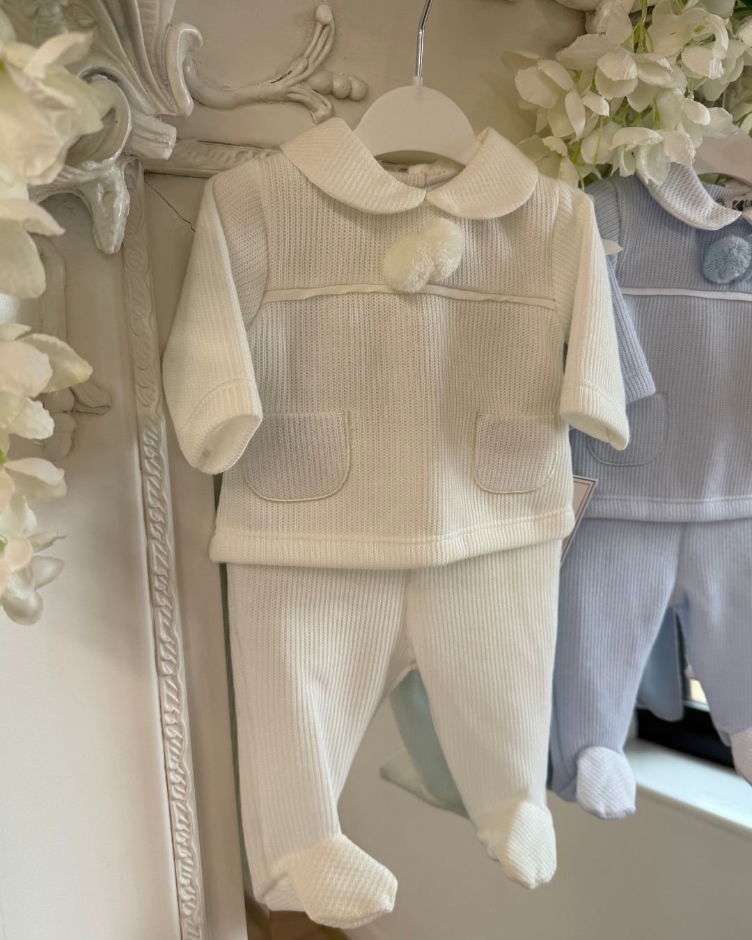 Baby knitted pom pom top and footed trouser set in ivory, baby blue and baby pink.
