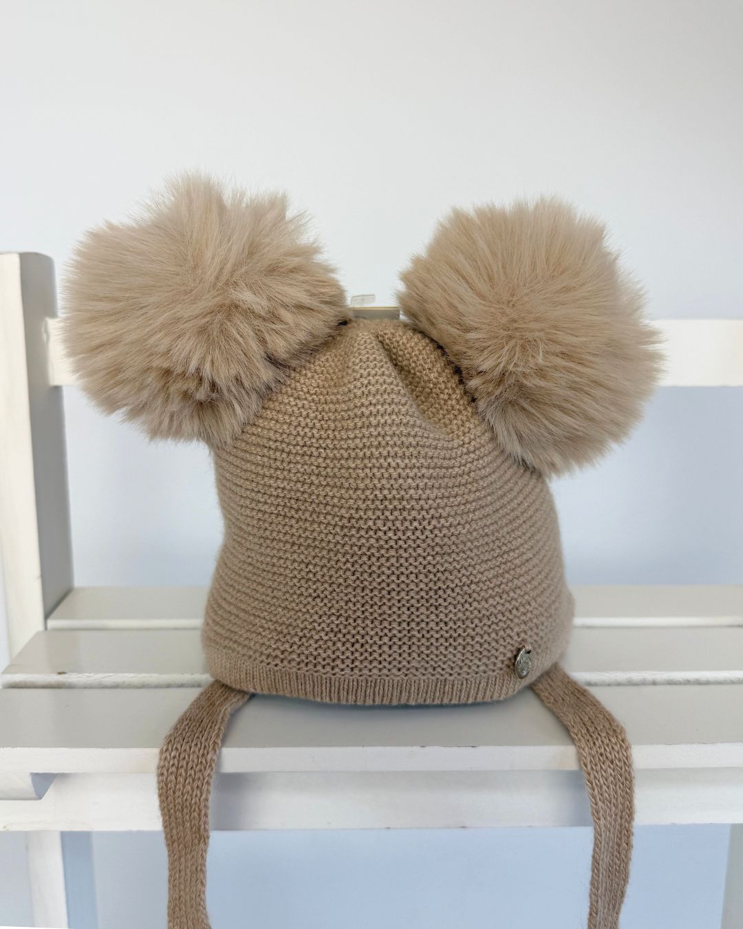 Jamiks Berit camel brown double faux fur pom baby winter hat with chin ties.