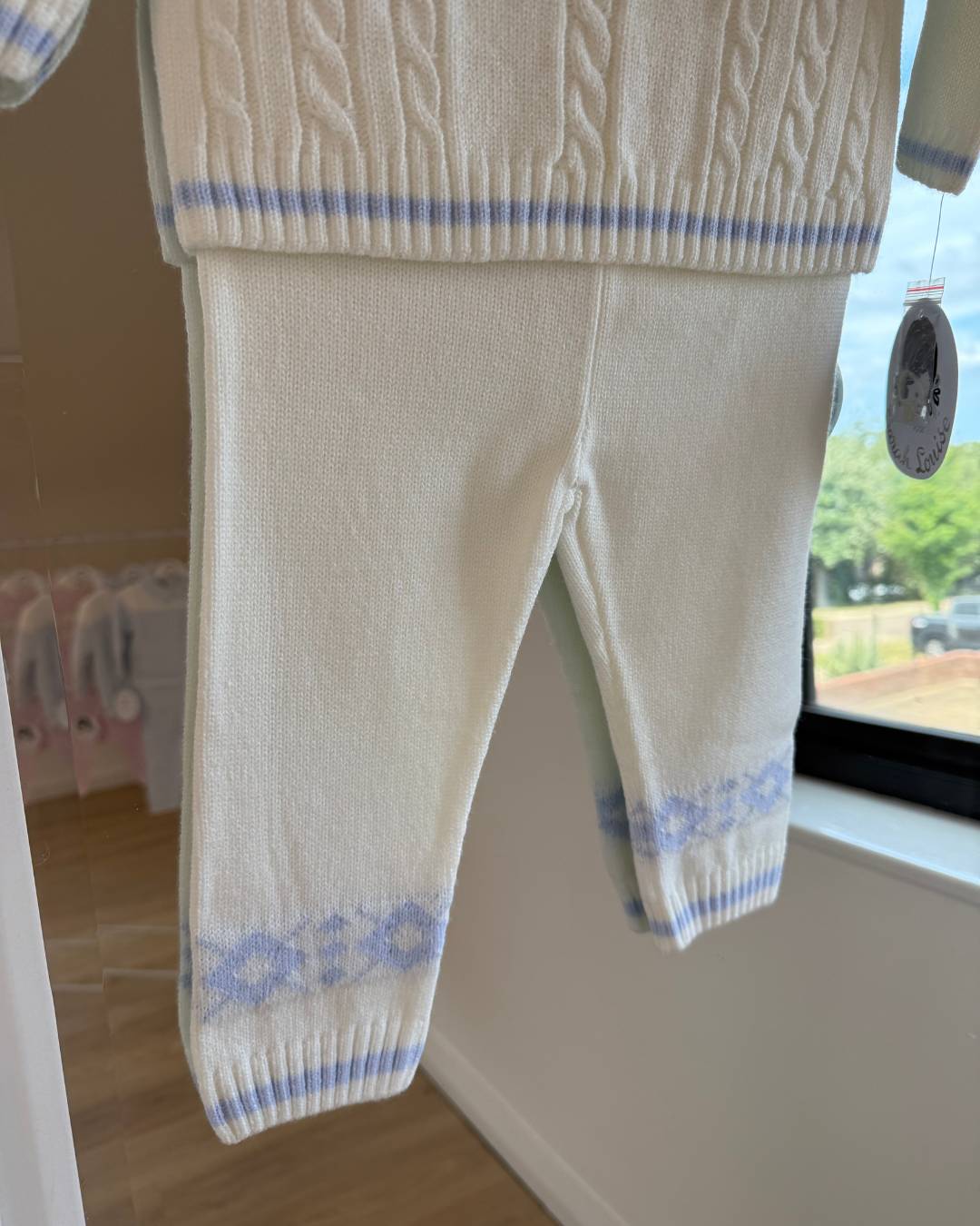Sarah Louise Aspen ivory and baby blue knitted boys trouser set with Fair Isle pattern and cable knit detailing.