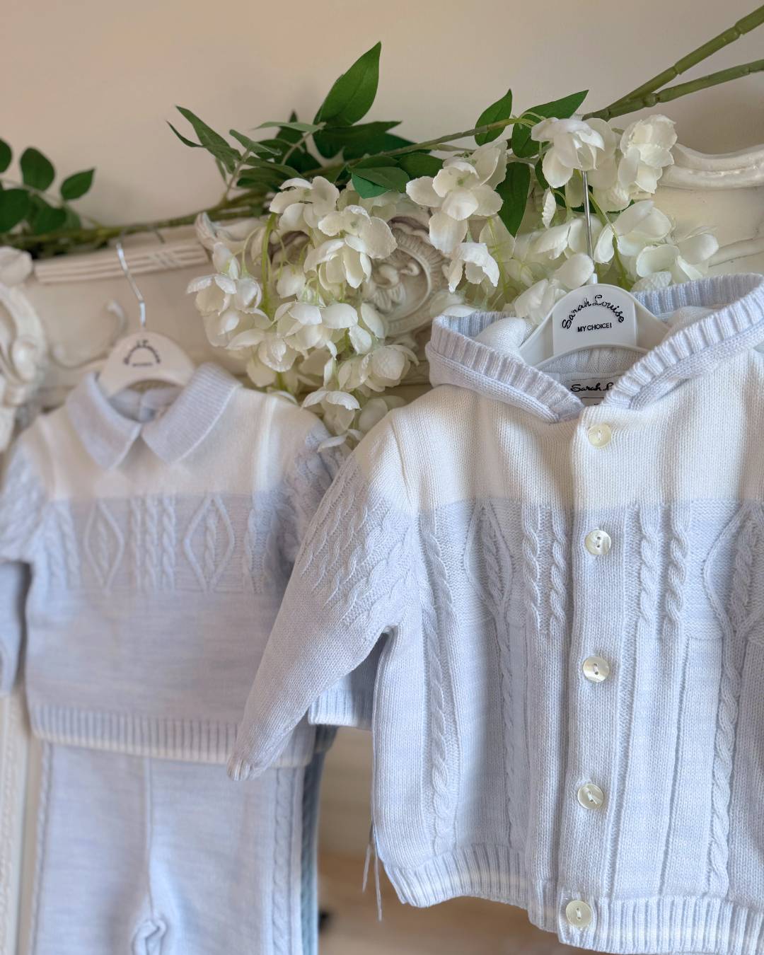 Sarah Louise Alfie baby blue and ivory boys knitted hooded coat with cable knit detailing.