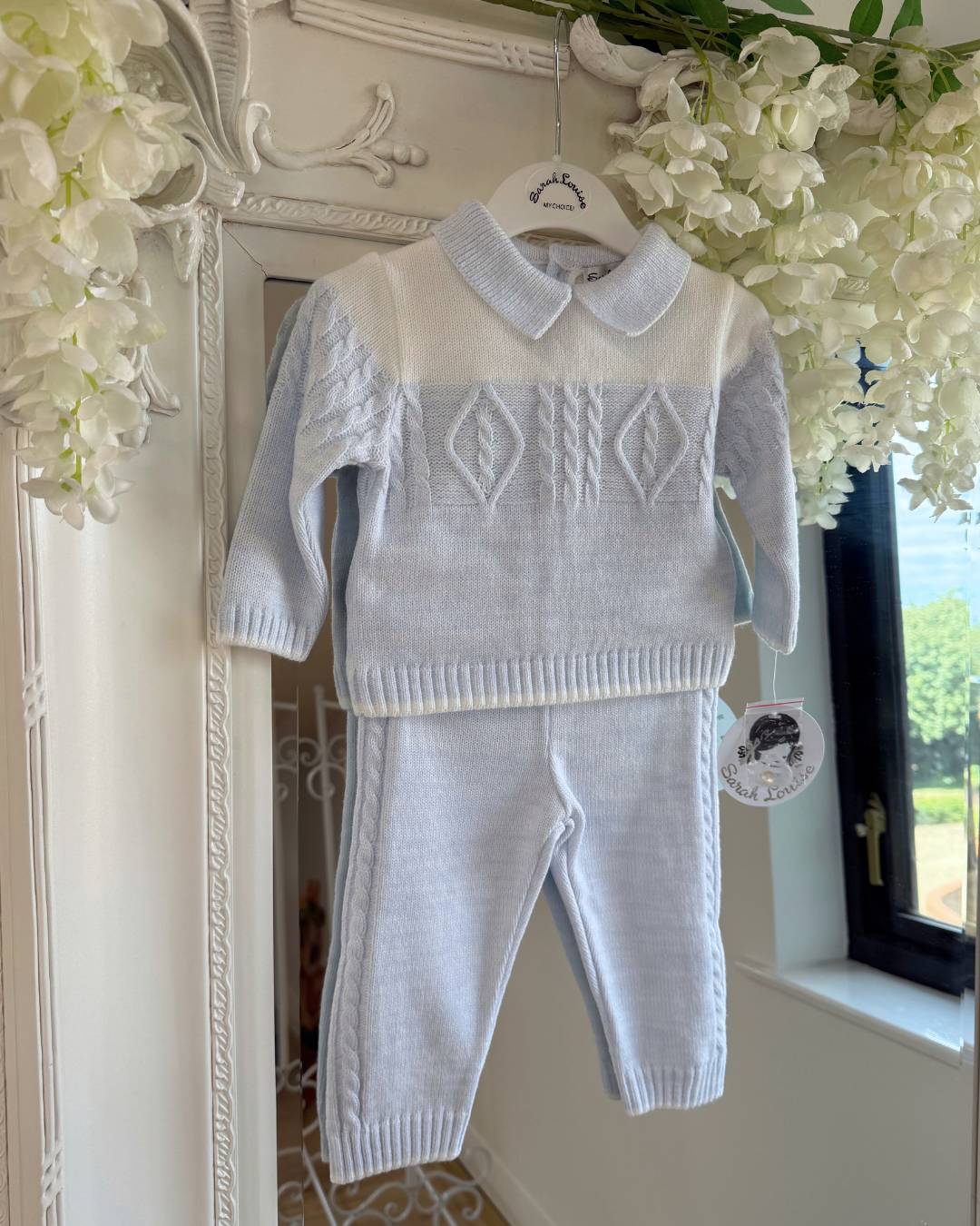 Sarah Louise Alfie baby blue and ivory boys knitted trouser set with cable knit detailing and collar.