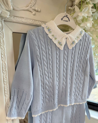 Sarah Louise Aster baby blue knitted trouser set with cable knit detailing and white floral embroidered collar.