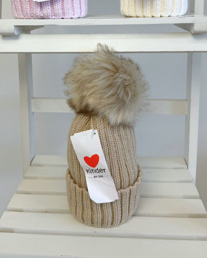 Kinder single faux fur pom knitted hats for babies and children in blue, grey, navy, pink, white and biscuit beige.