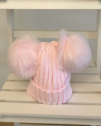 Kinder knitted double faux fur pom hats for babies and children in pink, baby blue, beige, grey and navy.