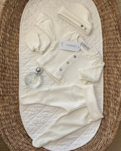 Calamaro Pearl ivory newborn baby girl gift set featuring a lace collar button-up top, matching footed trousers, baby mittens, hat and Calamaro signature baby perfume.