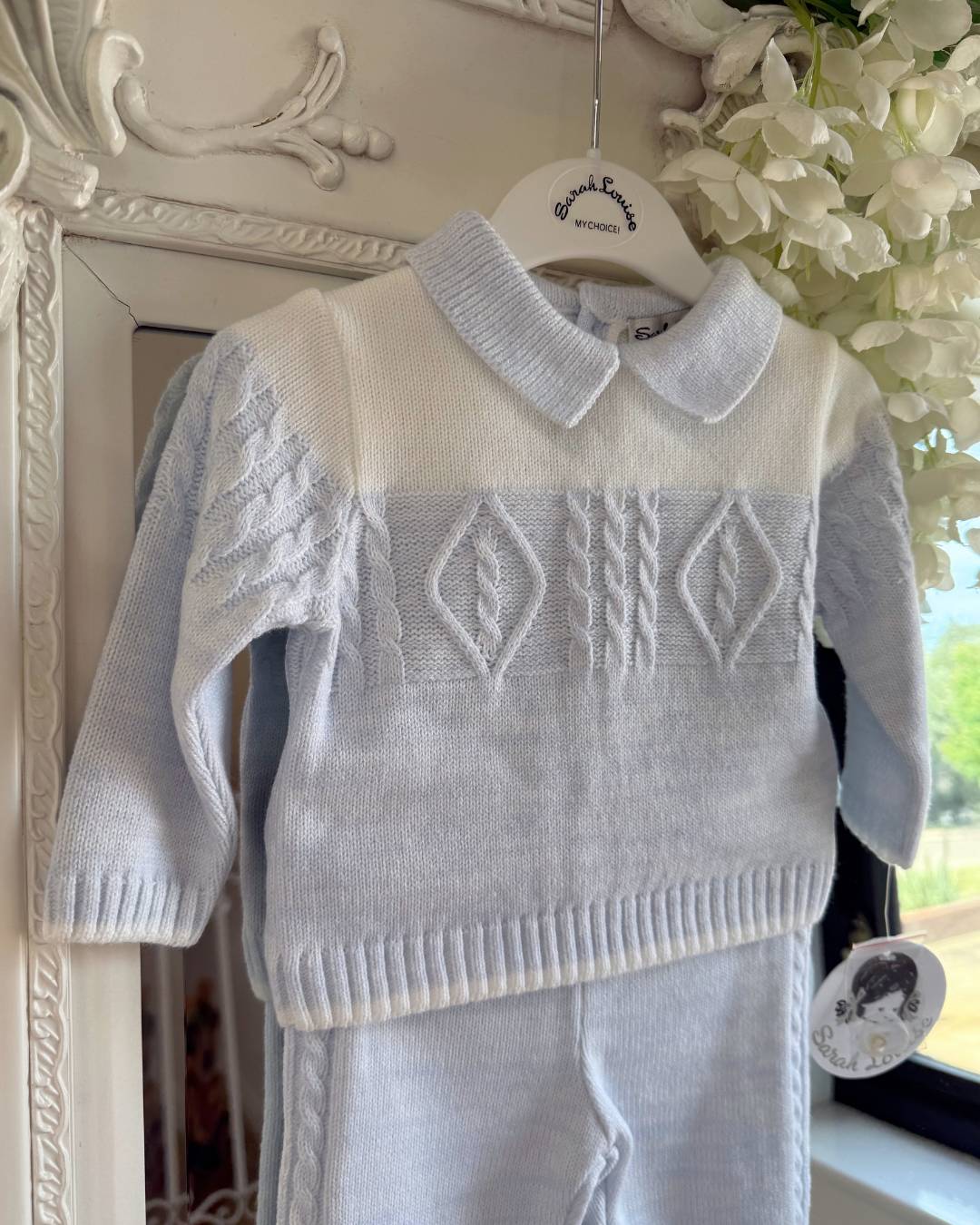 Sarah Louise Alfie baby blue and ivory boys knitted trouser set with cable knit detailing and collar.