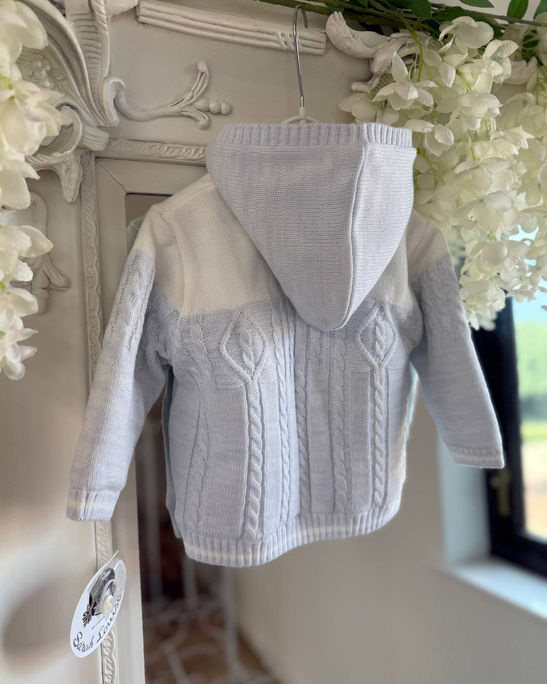 Sarah Louise Alfie baby blue and ivory boys knitted hooded coat with cable knit detailing.