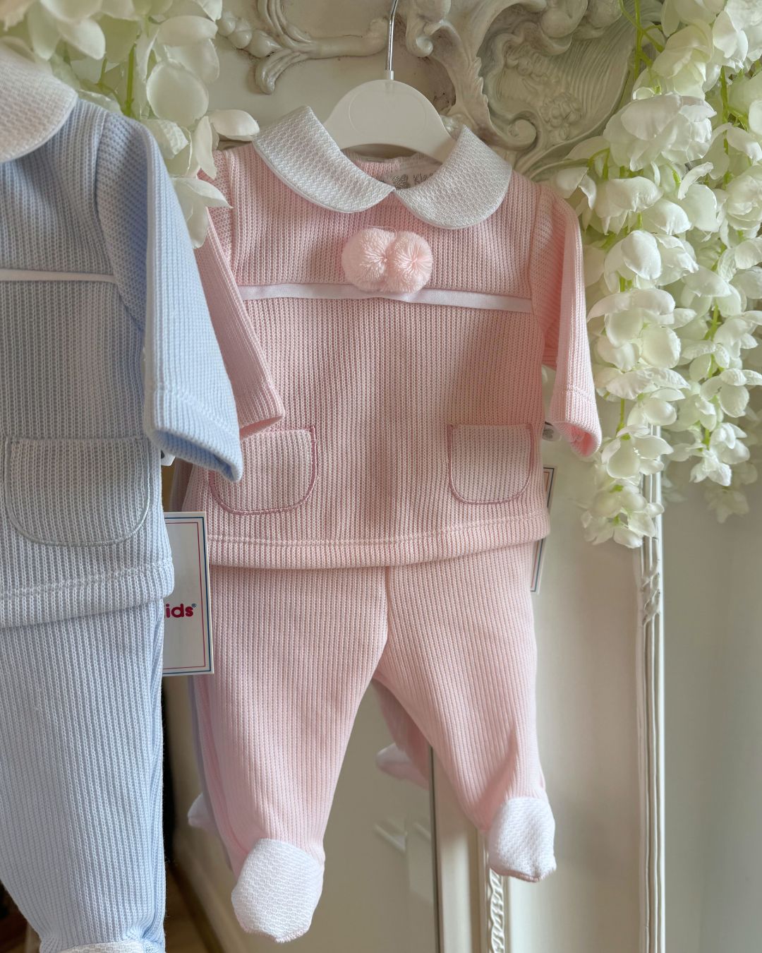 Baby knitted pom pom top and footed trouser set in ivory, baby blue and baby pink.
