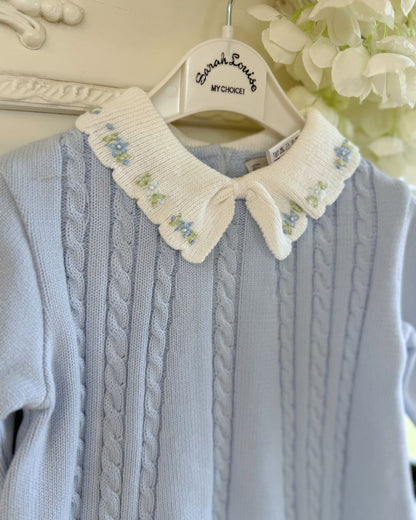 Sarah Louise Aster baby blue girls knitted dress with cable knit detailing, white scalloped floral embroidered collar and bow.