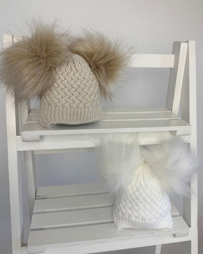 Little Nosh Curly Knit baby winter hat with twin faux fur pom poms, basketweave knit and cosy ear covers.