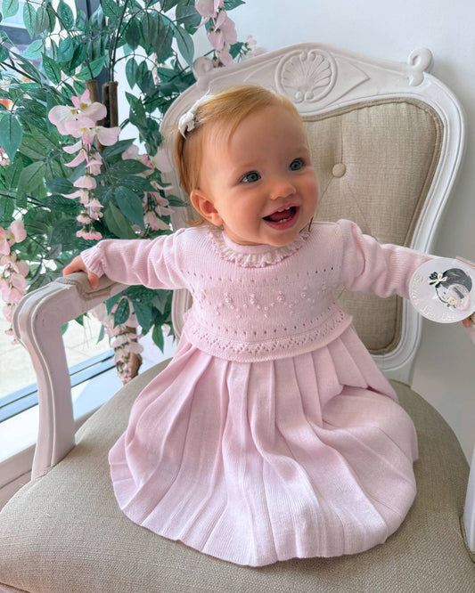 Sarah Louise Adeline pink knitted girls dress with ivory frill collar, hand embroidered roses and pleated skirt.