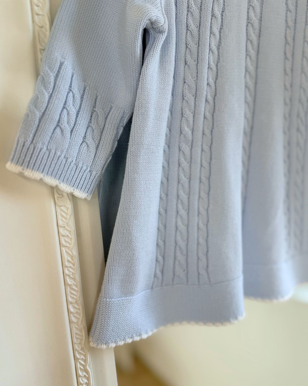 Sarah Louise Aster baby blue girls knitted dress with cable knit detailing, white scalloped floral embroidered collar and bow.