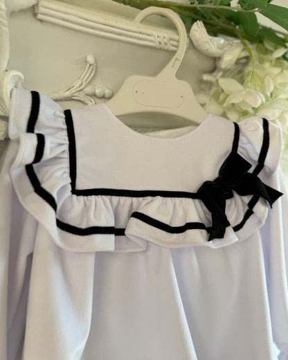 Fofettes X Be Chic Alba white velvet baby girls romper with sailor frill collar, black trim and velvet bow.