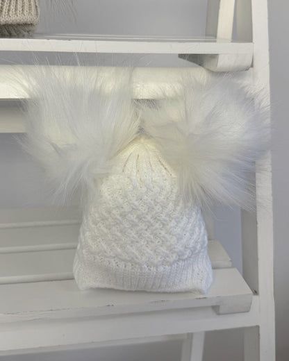 Little Nosh Curly Knit baby winter hat with twin faux fur pom poms, basketweave knit and cosy ear covers.