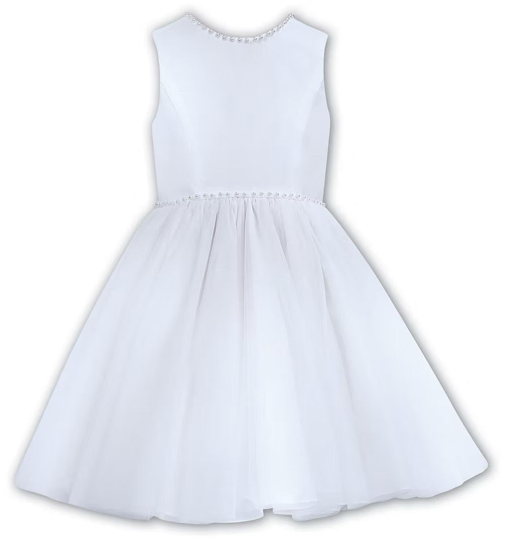 Sarah Louise White Pearl Ballerina Dress featuring a soft peach tone, pearl-trimmed neckline, full layered tulle skirt and statement V-back bow.