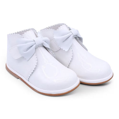 Borboleta Sharon Boot featuring white patent leather, front bow detail, Velcro fastening, anti-slip sole and a wide G/H fit.