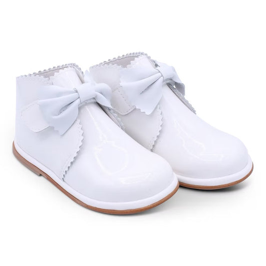 Borboleta Sharon Boot featuring white patent leather, front bow detail, Velcro fastening, anti-slip sole and a wide G/H fit.