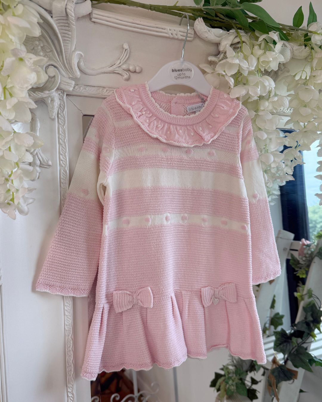 Bluesbaby Marie baby pink and cream knitted girls dress with frill collar, bows and pleated skirt.