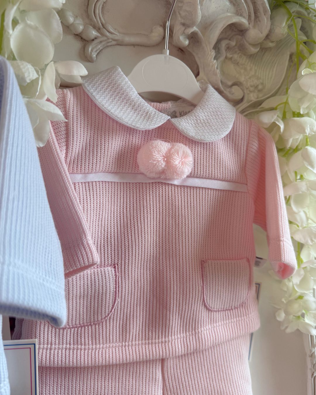 Baby knitted pom pom top and footed trouser set in ivory, baby blue and baby pink.