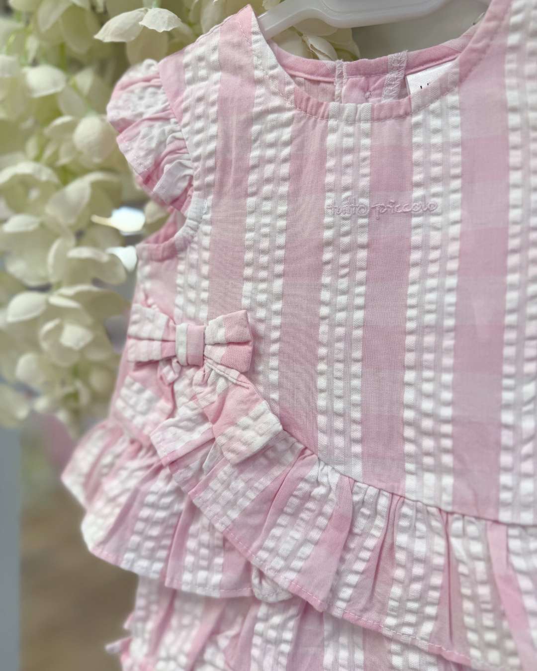 Tutto Piccolo Posie Jampant Set featuring a pink and white striped top with flutter sleeves, bow detail and matching striped bloomers.