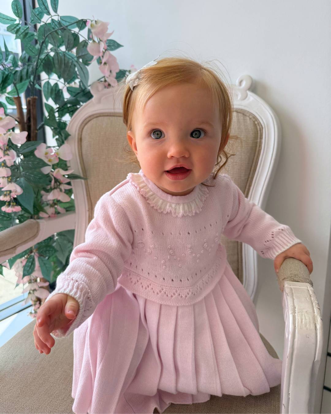 Sarah Louise Adeline pink knitted girls dress with ivory frill collar, hand embroidered roses and pleated skirt.