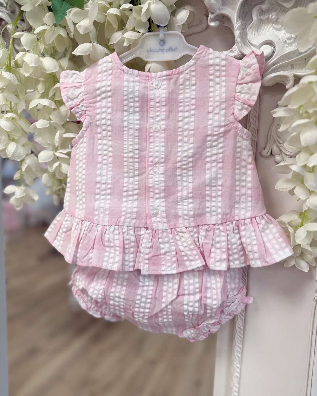 Tutto Piccolo Posie Jampant Set featuring a pink and white striped top with flutter sleeves, bow detail and matching striped bloomers.