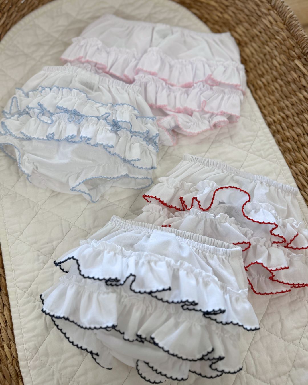 Sarah Louise white baby girls ruffle knickers with layered frill back and contrasting pink, navy or red trim.