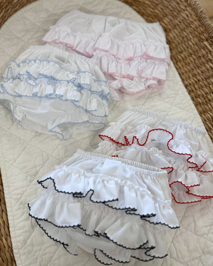 Sarah Louise white baby girls ruffle knickers with layered frill back and contrasting pink, navy or red trim.