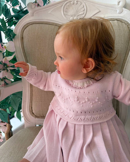 Sarah Louise Adeline pink knitted girls dress with ivory frill collar, hand embroidered roses and pleated skirt.
