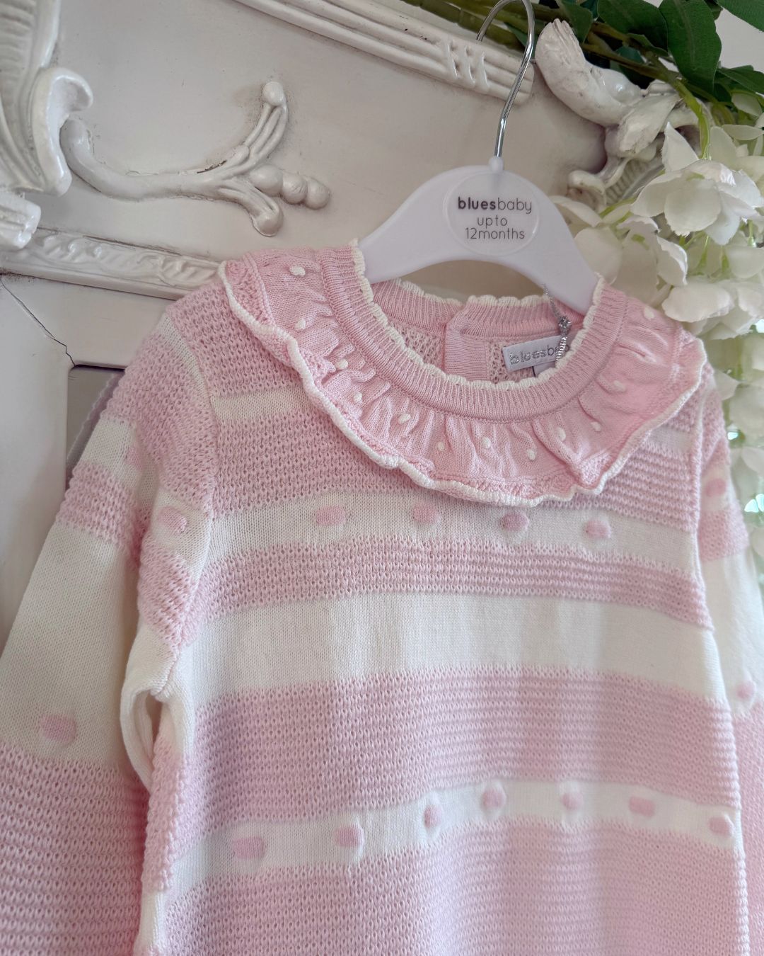 Bluesbaby Marie baby pink and cream knitted girls dress with frill collar, bows and pleated skirt.