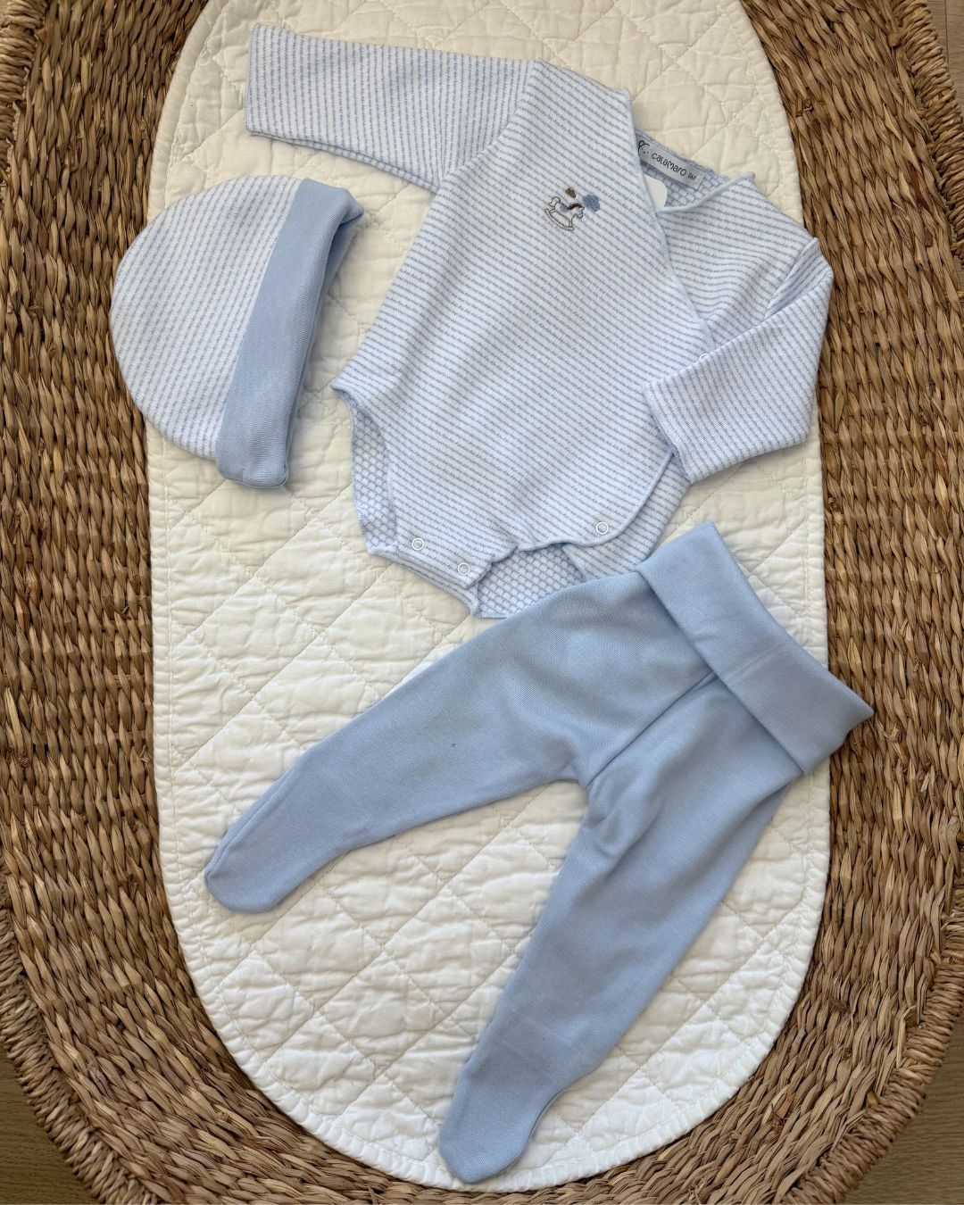 Calamaro Rocking Horse newborn baby gift set in pink and blue, featuring a striped wrap bodysuit with embroidered rocking horse, matching footed trousers and coordinating hat.