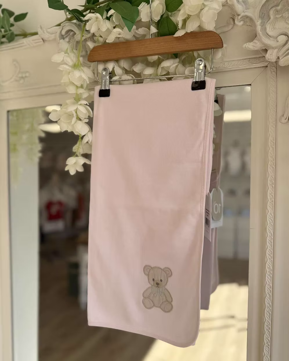 Baby Gi Teddy Shawl featuring soft cotton fabric, embroidered teddy bear detail and available in ivory, pink and blue colourways.