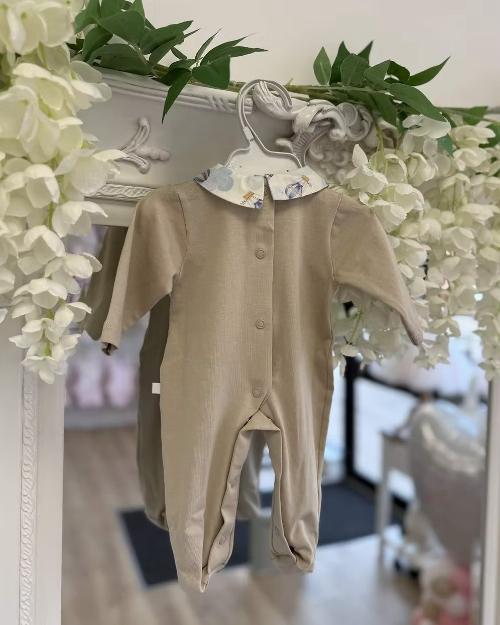Deolinda Air Balloon Babygrow featuring a hot air balloon and bear print, neutral lower half, Peter Pan collar and popper fastening.